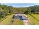 A lovely single-story home boasts stone accents, a two-car garage, and a spacious lawn at 1741 Eldorado Ct, St Cloud, FL 34771
