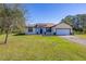 Attractive single-story home boasts stone accents, two-car garage, and expansive lawn at 1741 Eldorado Ct, St Cloud, FL 34771