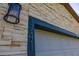 Exterior of the home features a light fixture above the address and a white garage door at 1741 Eldorado Ct, St Cloud, FL 34771