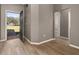 Inviting foyer with wood-look flooring and neutral paint, seamlessly connecting to other living areas at 1741 Eldorado Ct, St Cloud, FL 34771