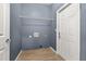 Functional laundry room with washer and dryer hookups and a rack for storing necessities at 1741 Eldorado Ct, St Cloud, FL 34771