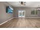 Spacious living room featuring tile flooring, double doors, and natural light from a window at 1741 Eldorado Ct, St Cloud, FL 34771