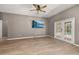 Bright living room with pool view, ceiling fan, tile floors and TV at 1741 Eldorado Ct, St Cloud, FL 34771