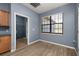 Mud room with washer and dryer hook ups, overhead rack for storage, and natural light from the window at 1741 Eldorado Ct, St Cloud, FL 34771
