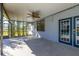 Covered patio showing ceiling fan and view of the pool and lush landscaping, great for outdoor enjoyment at 1741 Eldorado Ct, St Cloud, FL 34771