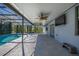 Spacious covered patio with ceiling fans and a view of the screened-in pool, perfect for outdoor relaxation at 1741 Eldorado Ct, St Cloud, FL 34771
