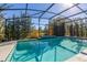 Enjoy sunny days in this lovely screened-in pool with inviting cool water and green outdoor views at 1741 Eldorado Ct, St Cloud, FL 34771