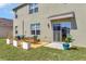 Outdoor patio with table and chairs, potted plants, and sliding door access to home at 1755 Buckeye Rd, Davenport, FL 33837