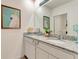 Stylish bathroom featuring double sinks, granite countertops and modern lighting at 1755 Buckeye Rd, Davenport, FL 33837