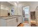 Bathroom featuring double sinks, granite countertops and modern lighting at 1755 Buckeye Rd, Davenport, FL 33837