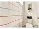 Bright bathroom featuring a toilet and a curtained shower at 1755 Buckeye Rd, Davenport, FL 33837