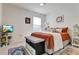 Cozy bedroom featuring an accent wall, bed with decorative pillows, and plush carpeting at 1755 Buckeye Rd, Davenport, FL 33837