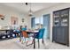 Dining room with table, hutch, and blue accent chairs at 1755 Buckeye Rd, Davenport, FL 33837