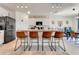 Modern eat-in kitchen with an island, granite countertops, and stainless steel appliances at 1755 Buckeye Rd, Davenport, FL 33837