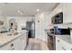 Spacious kitchen features stainless steel appliances, granite countertops, and modern cabinetry at 1755 Buckeye Rd, Davenport, FL 33837