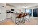 Bright kitchen with bar stool seating and a stainless steel appliance package at 1755 Buckeye Rd, Davenport, FL 33837
