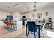 Modern kitchen features a central island, a breakfast bar, and a dining area with stylish seating at 1755 Buckeye Rd, Davenport, FL 33837