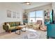 Cozy living room with stylish decor, ample seating, and plenty of natural light at 1755 Buckeye Rd, Davenport, FL 33837