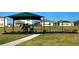 Community playground with shade, swings, slides, and other various fun and engaging equipment at 1755 Buckeye Rd, Davenport, FL 33837