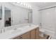 Bathroom boasts double sinks, and a shower-tub combination with a door leading into a bedroom at 238 N Hampton Dr, Davenport, FL 33897