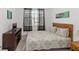 Cozy bedroom with a large window and dark wooden furniture at 238 N Hampton Dr, Davenport, FL 33897