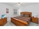 Comfortable bedroom with a wooden bed frame and side tables at 238 N Hampton Dr, Davenport, FL 33897