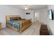 The bedroom features a ceiling fan, carpeted floors, and a bathroom and closet nearby at 238 N Hampton Dr, Davenport, FL 33897