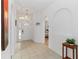 Bright foyer with tiled floors, arched doorways, and decorative hanging light fixture at 238 N Hampton Dr, Davenport, FL 33897