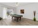 Spacious game room featuring a pool table and sliding glass doors to the backyard at 238 N Hampton Dr, Davenport, FL 33897