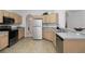 Bright kitchen featuring stainless steel appliances and light wood cabinetry at 238 N Hampton Dr, Davenport, FL 33897