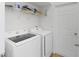 Well-equipped laundry room featuring a modern washer and dryer at 238 N Hampton Dr, Davenport, FL 33897