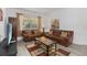 Comfortable seating area featuring leather sofas and a glass coffee table at 238 N Hampton Dr, Davenport, FL 33897