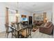 Cozy living room area with a dining table and comfortable leather sofas at 238 N Hampton Dr, Davenport, FL 33897
