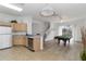 Open floor plan shows kitchen adjacent to a living room with a billiard table at 238 N Hampton Dr, Davenport, FL 33897