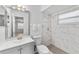 Well-lit bathroom featuring modern fixtures and a sleek, marble-tiled shower at 2424 Barley Club Ct # 8, Orlando, FL 32837