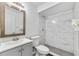 Well-lit bathroom featuring modern fixtures and a sleek, marble-tiled shower at 2424 Barley Club Ct # 8, Orlando, FL 32837