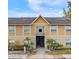 Charming two-story exterior showcasing brick accents, manicured landscaping, and inviting entryway at 2424 Barley Club Ct # 8, Orlando, FL 32837