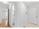 Bright hallway leading to a bathroom and the front door at 2424 Barley Club Ct # 8, Orlando, FL 32837