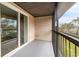 Enjoy the fresh air on this screened balcony with a sliding glass door at 2424 Barley Club Ct # 8, Orlando, FL 32837