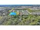 Aerial view of community featuring single-Gathering homes and a scenic lake and surrounding landscape at 246 Tomelloso Way, Davenport, FL 33837