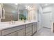 Bathroom featuring double vanity, walk-in shower, and neutral tile at 246 Tomelloso Way, Davenport, FL 33837