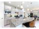 Gourmet kitchen with granite counters, stainless steel appliances, and a breakfast bar at 246 Tomelloso Way, Davenport, FL 33837