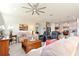 Spacious living room with tile floors is open to the kitchen and dining area at 246 Tomelloso Way, Davenport, FL 33837
