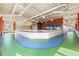 Indoor running track with a rubberized surface, ideal for year-round exercise in the community center at 246 Tomelloso Way, Davenport, FL 33837