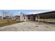 View of the home's side with a carport and spacious driveway at 3118 Cedar St, Lake Wales, FL 33898