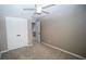 Bedroom with ceiling fan, carpet and double door closet at 3199 Turret Dr, Kissimmee, FL 34743