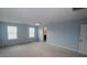 Large bedroom with blue walls and ample natural light from two windows at 3199 Turret Dr, Kissimmee, FL 34743