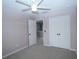Bright bedroom with neutral walls, plush carpeting, and ample closet space at 3199 Turret Dr, Kissimmee, FL 34743