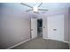 Neutral bedroom features fan, carpet, and closet space at 3199 Turret Dr, Kissimmee, FL 34743