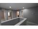 Hallway with neutral color scheme, leading to bathroom and bedrooms at 3199 Turret Dr, Kissimmee, FL 34743